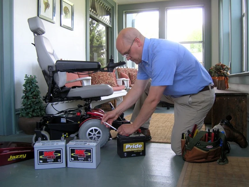 Senior checking the Battery lifespan information for mobility scooters