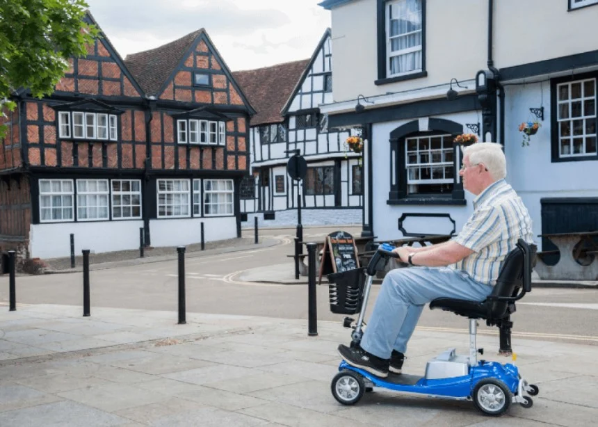 Senior testing the Battery lifespan on a mobility scooter
