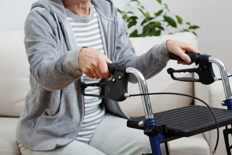 Elderly woman using a walker illustrating standard width