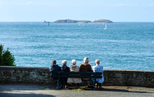seniors sitting looking over the bay celebrating international day of the older person