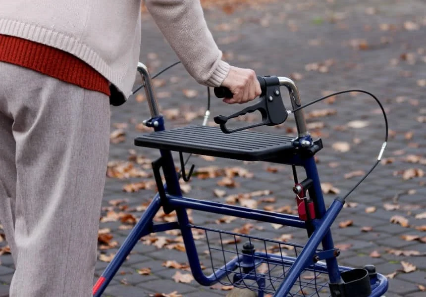 senior demonstrating a walker in use