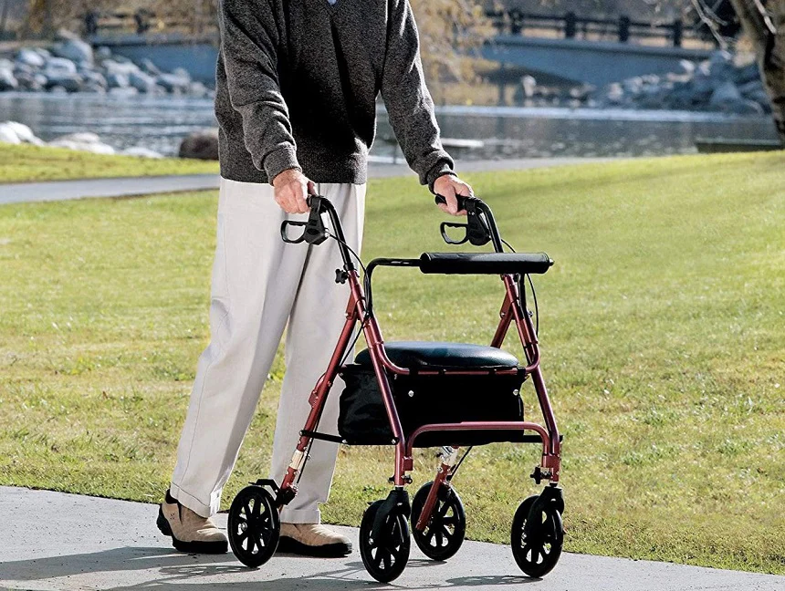 Senior person testing a walker with a seat
