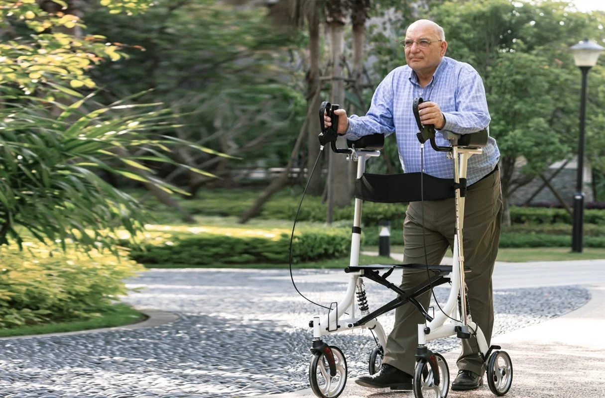 A walker adjusted to accommodate a tall elderly person