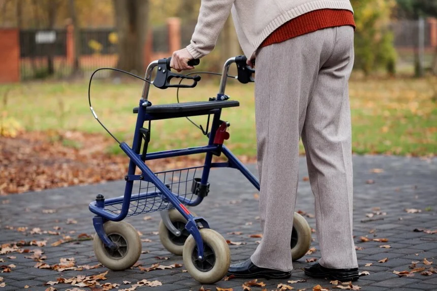 Elderly person struggling with balance and mobility support